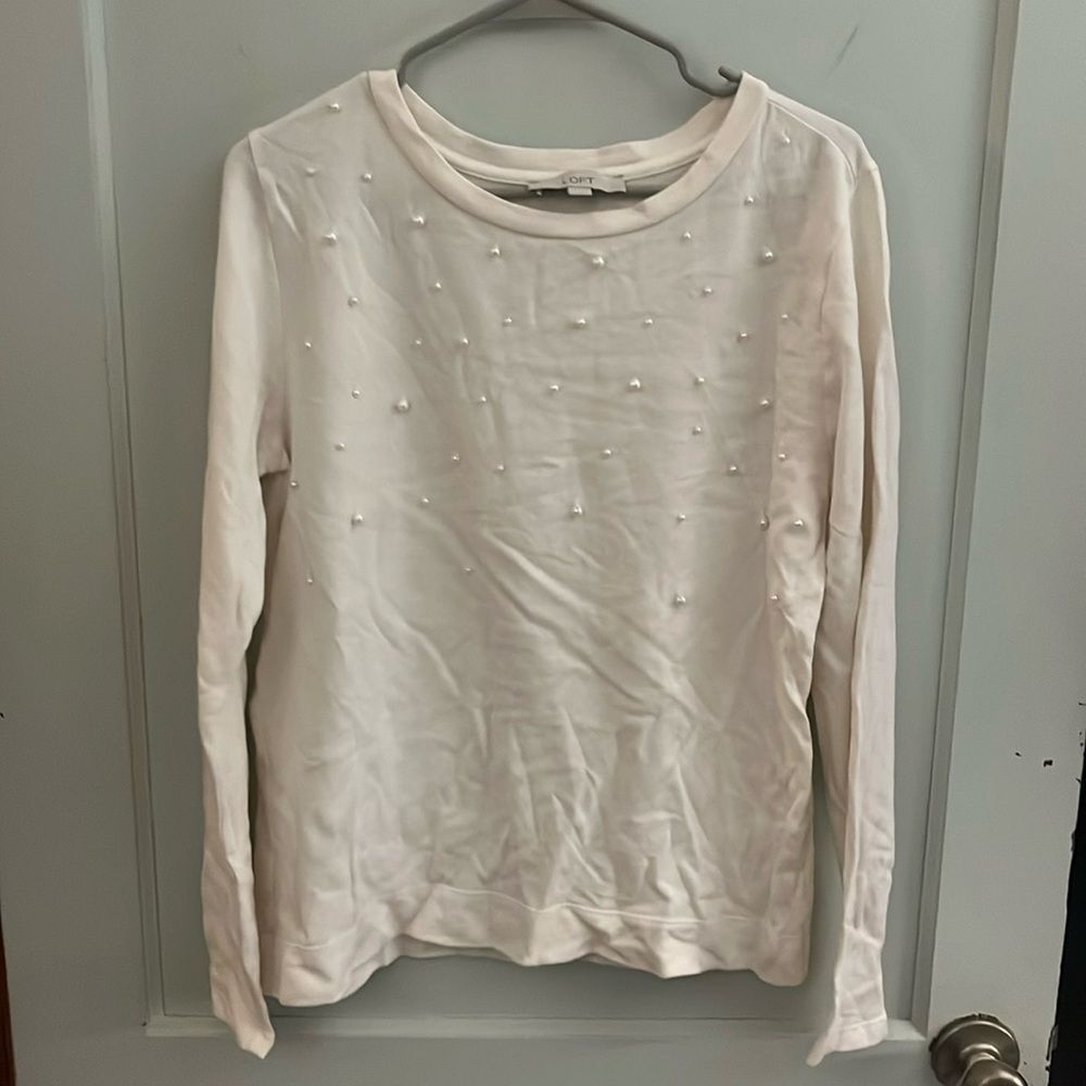 Crème sweater from Loft size Medium 
Pearl buttons on sweater front